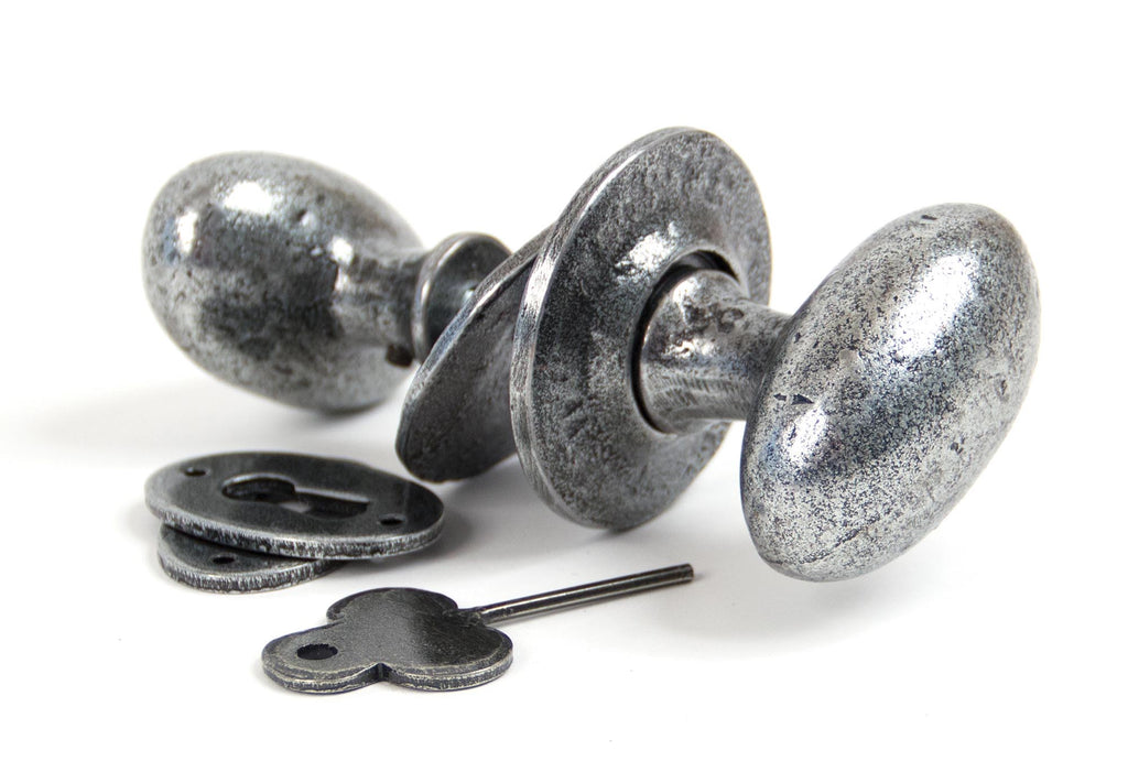 From The Anvil's Pewter Patina Oval Mortice/Rim Knob Set