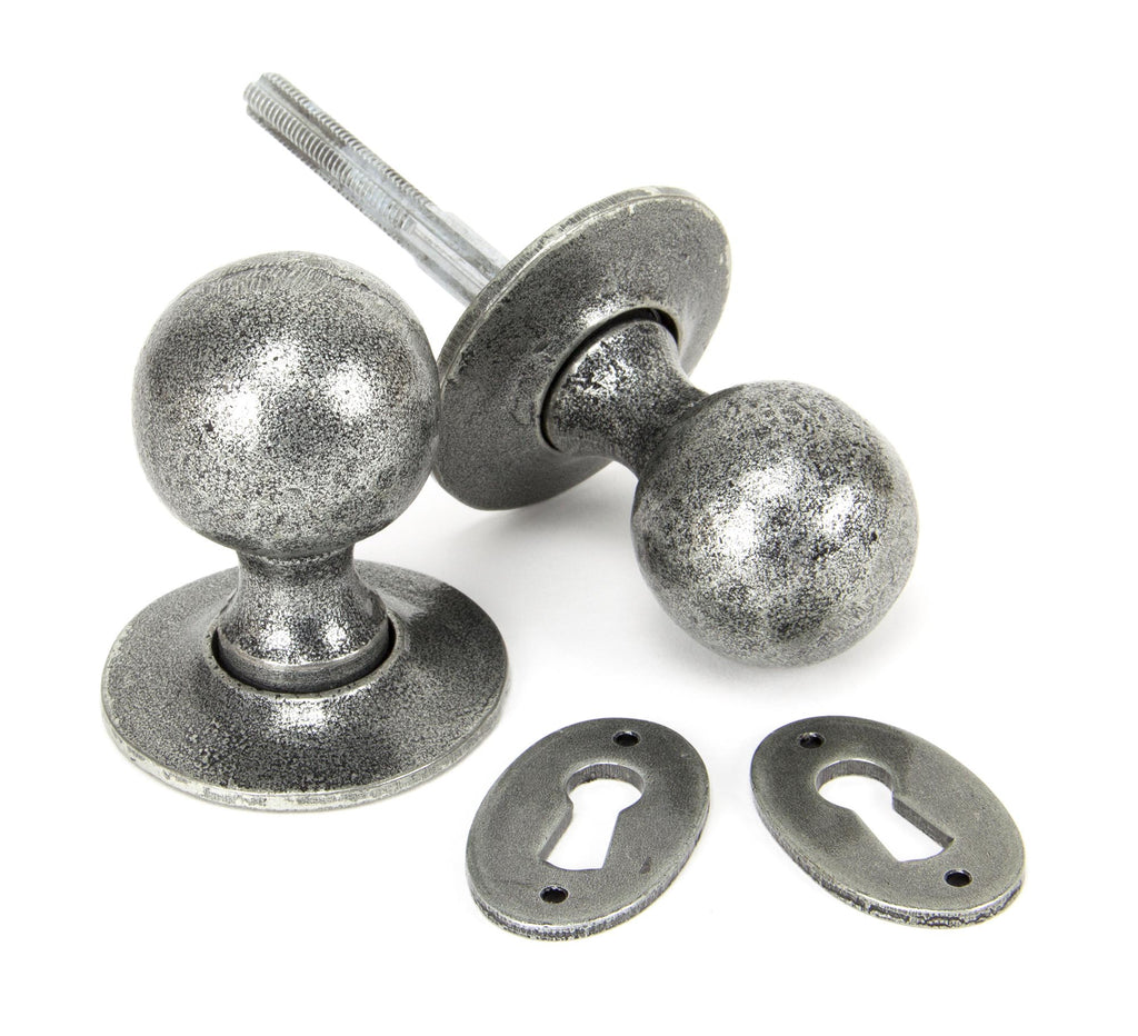 From The Anvil's Pewter Patina Round Mortice/Rim Knob Set