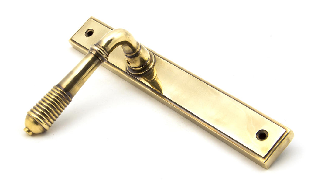 From The Anvil's Aged Brass Reeded Slimline Lever Espag. Latch Set