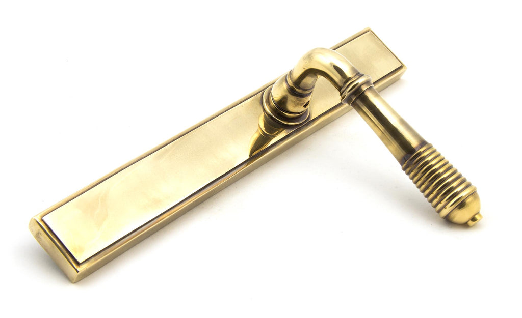 From The Anvil's Aged Brass Reeded Slimline Lever Espag. Latch Set