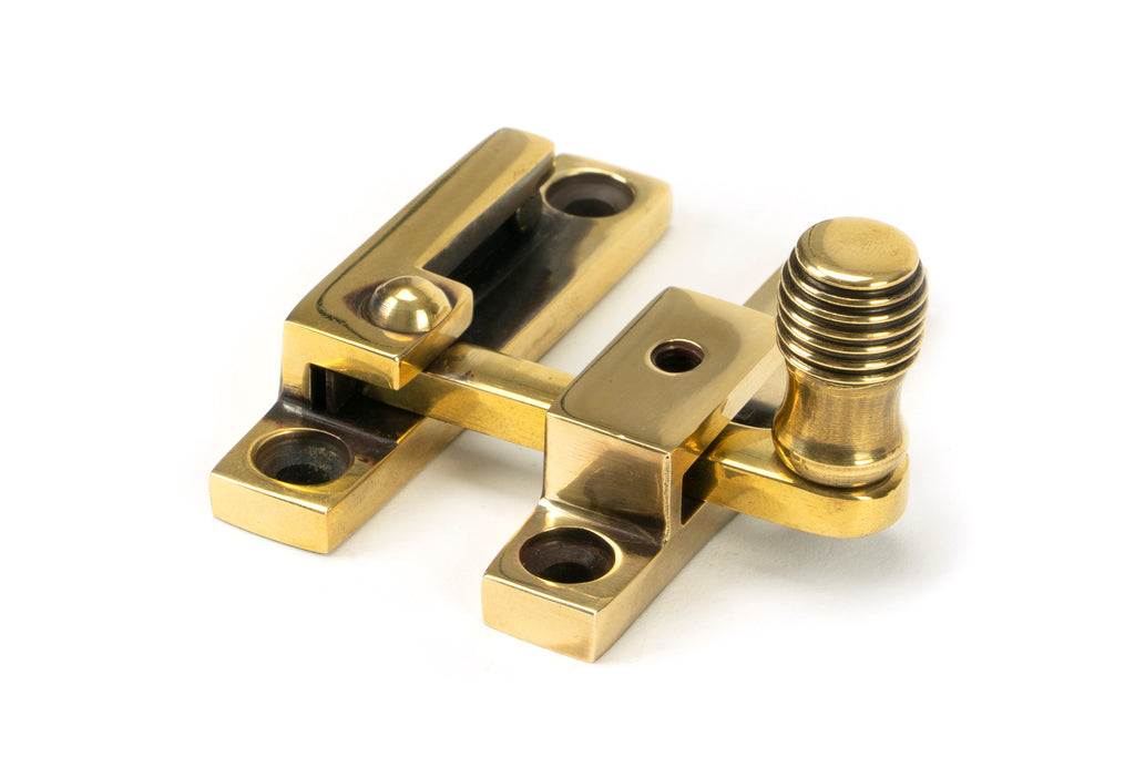 From The Anvil's Aged Brass Beehive Quadrant Fastener - Narrow