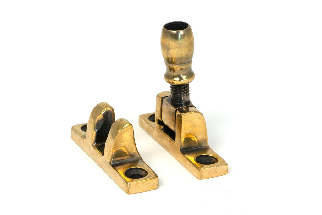 From The Anvil's Aged Brass Mushroom Brighton Fastener