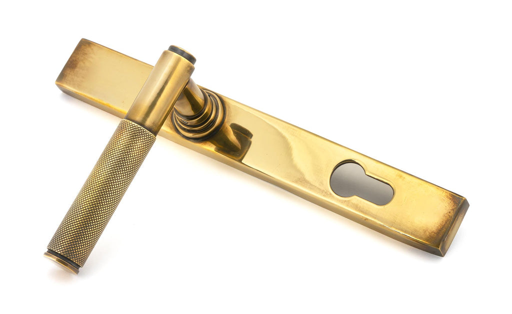 From The Anvil's Aged Brass Brompton Slimline Lever Espag. Lock Set