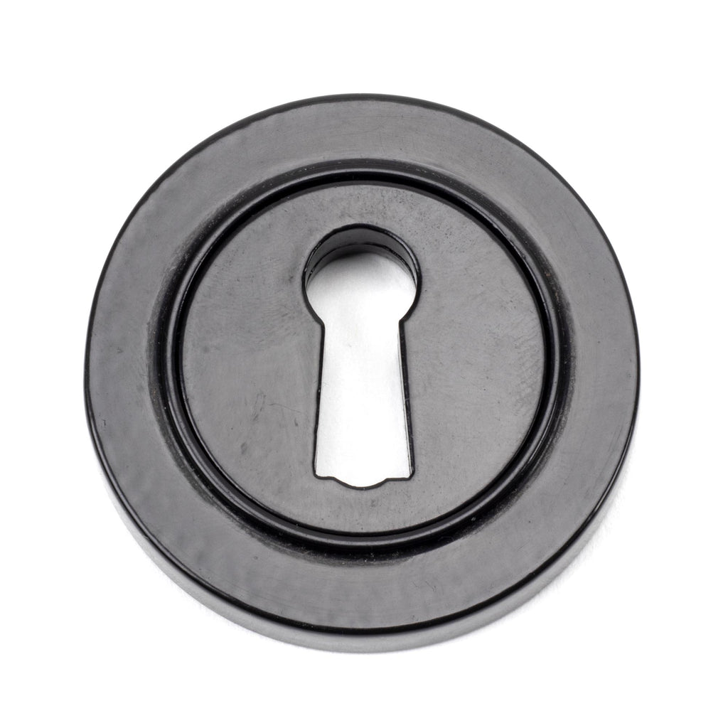 From The Anvil's Black Round Escutcheon