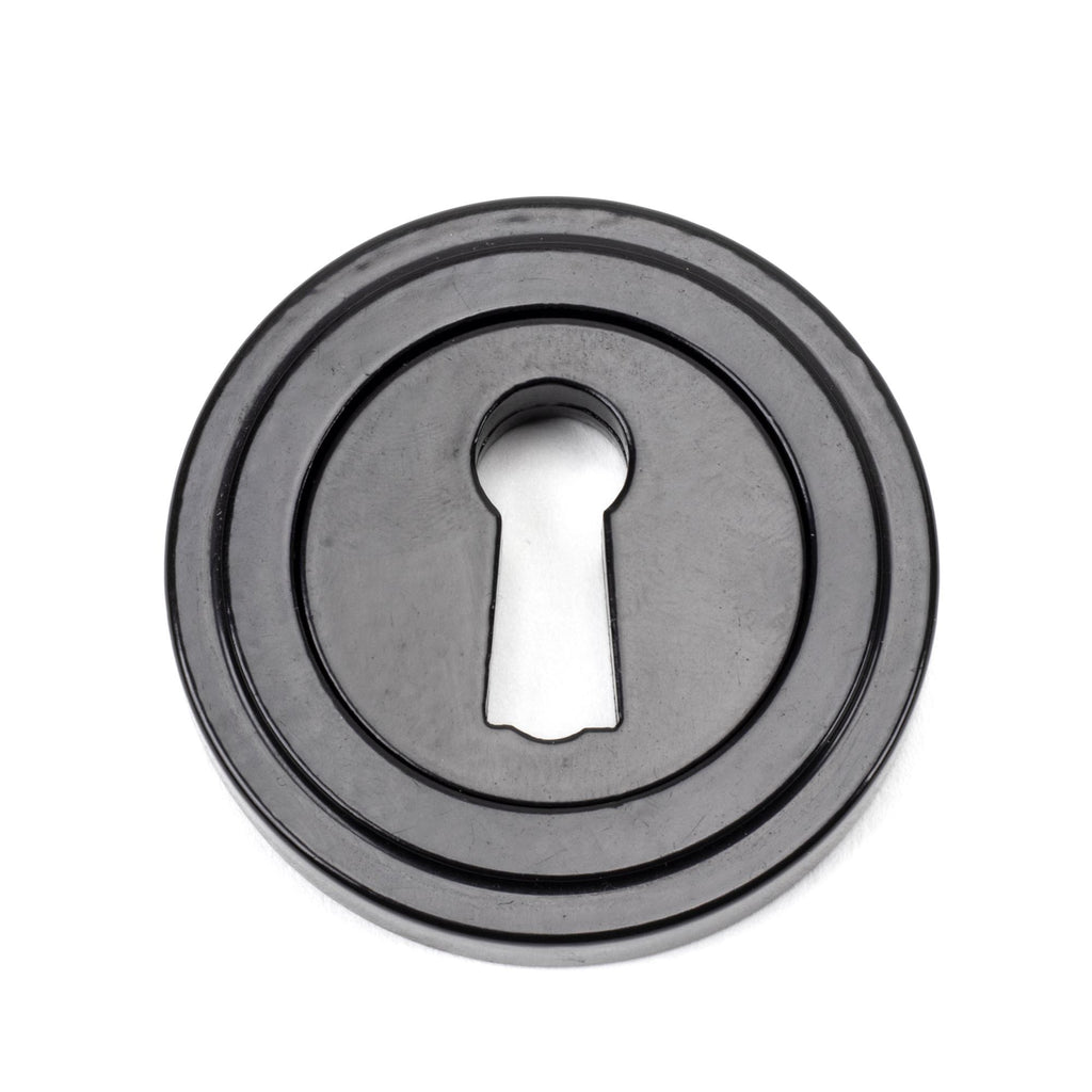 From The Anvil's Black Round Escutcheon