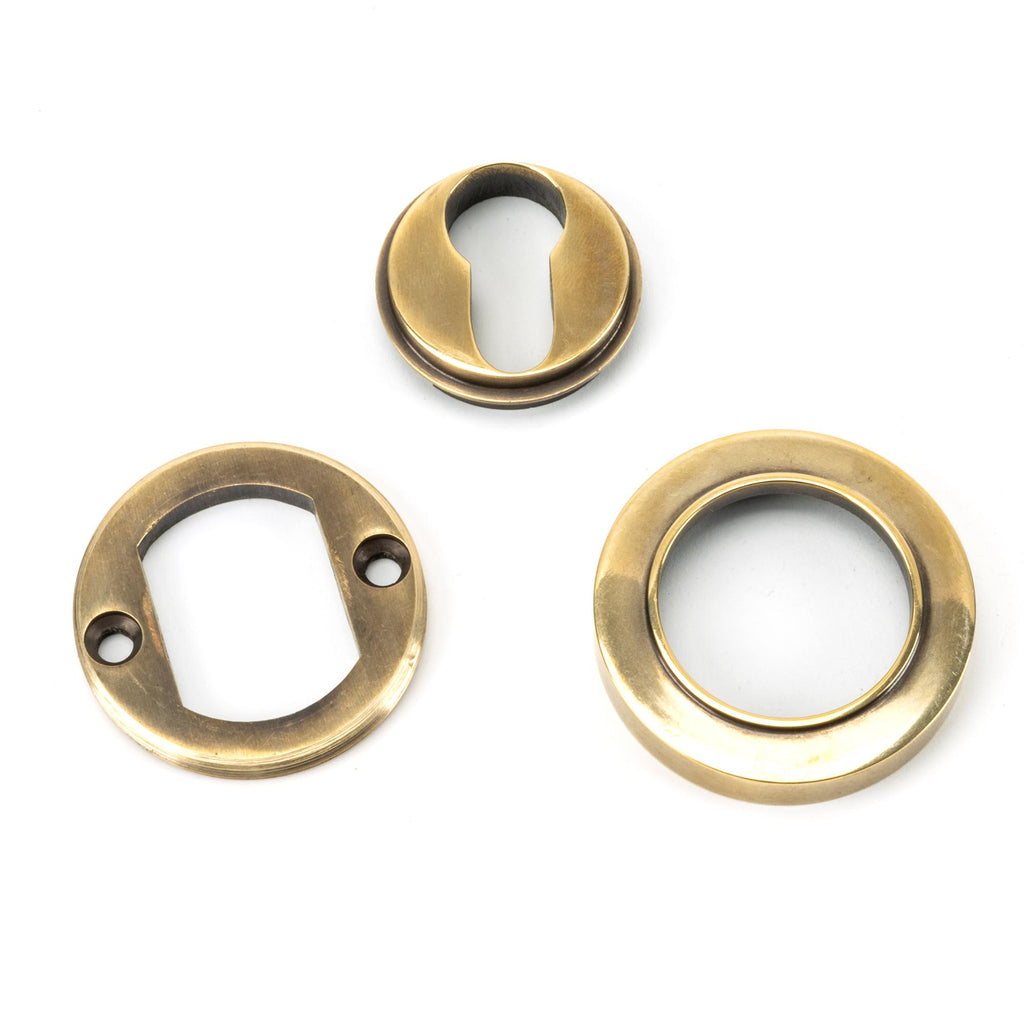 From The Anvil's Aged Brass Round Euro Escutcheon