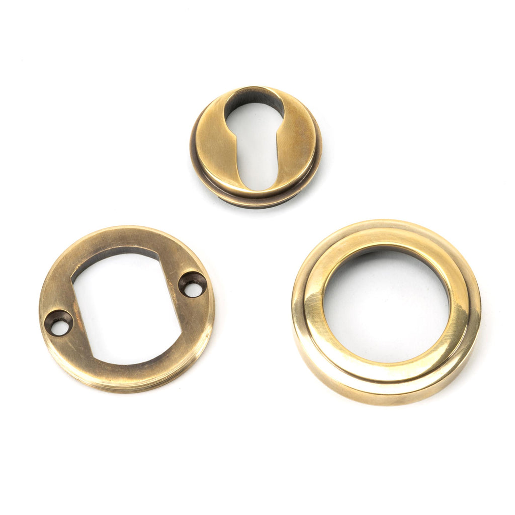 From The Anvil's Aged Brass Round Euro Escutcheon