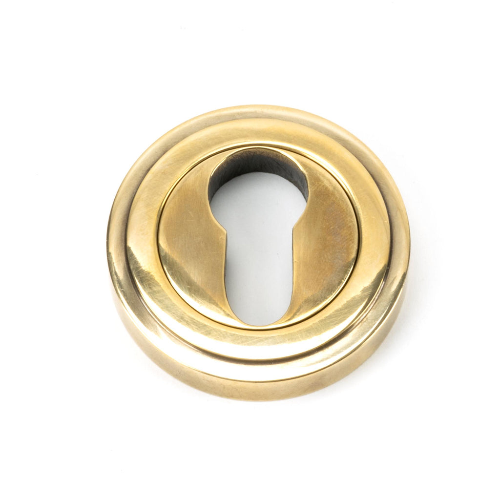 From The Anvil's Aged Brass Round Euro Escutcheon