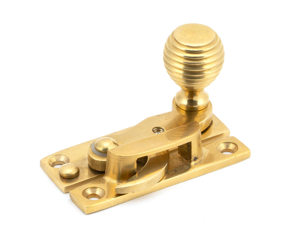 From The Anvil's Polished Brass Beehive Sash Hook Fastener