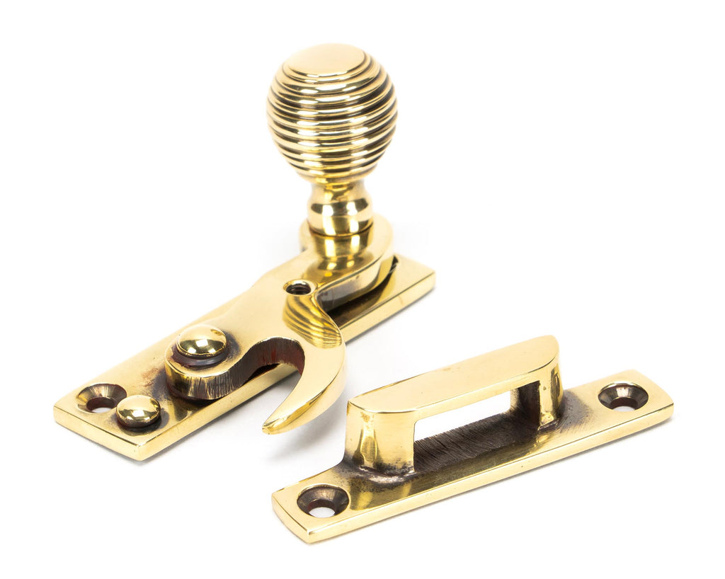 From The Anvil's Aged Brass Beehive Sash Hook Fastener