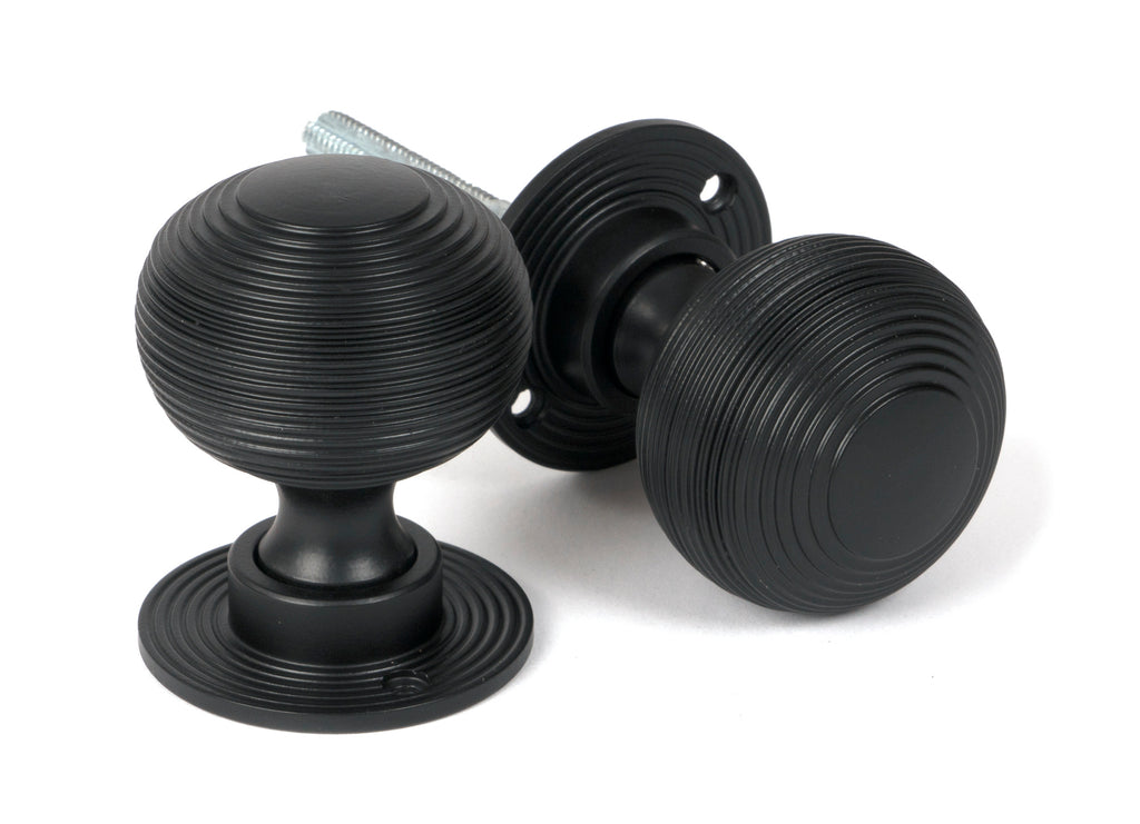 From The Anvil's Matt Black Heavy Beehive Mortice/Rim Knob Set