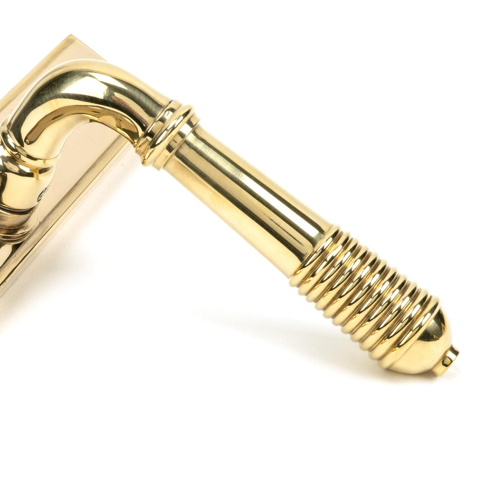 From The Anvil's Polished Brass Reeded Slimline Lever Espag. Lock Set