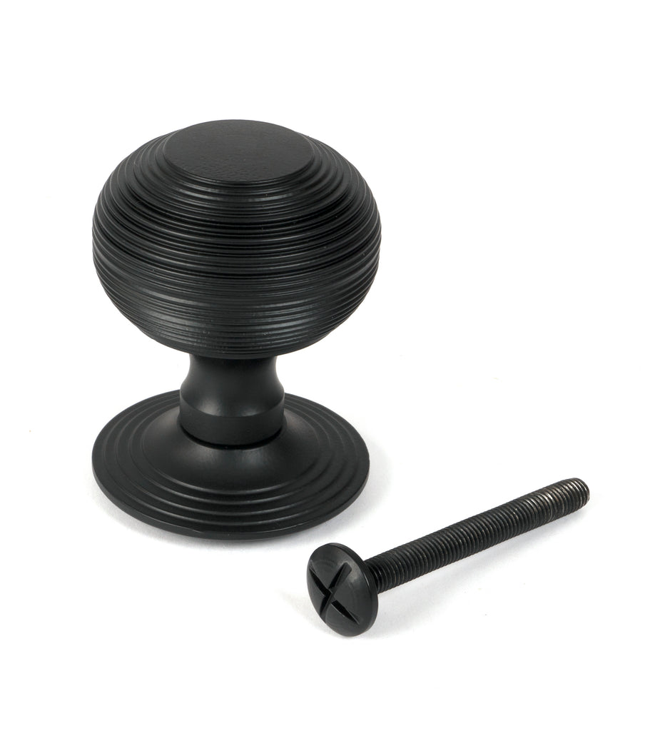 From The Anvil's Matt Black Beehive Centre Door Knob