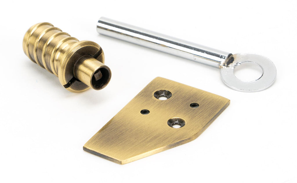 From The Anvil's Aged Brass Key-Flush Sash Stop