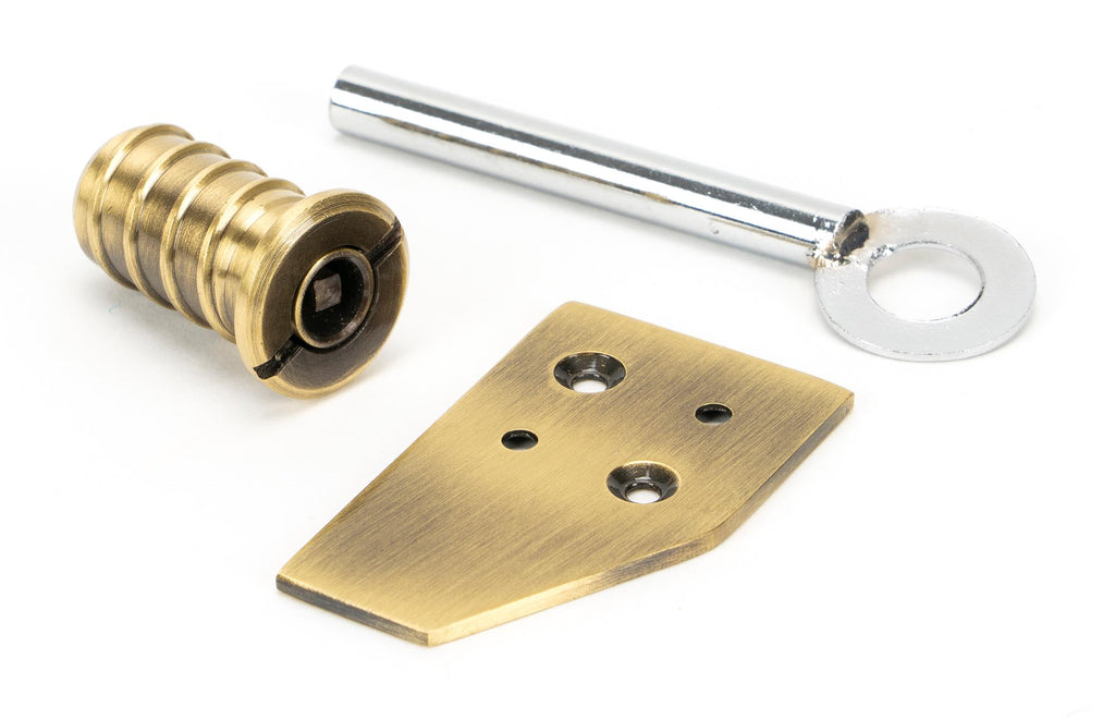 From The Anvil's Aged Brass Key-Flush Sash Stop