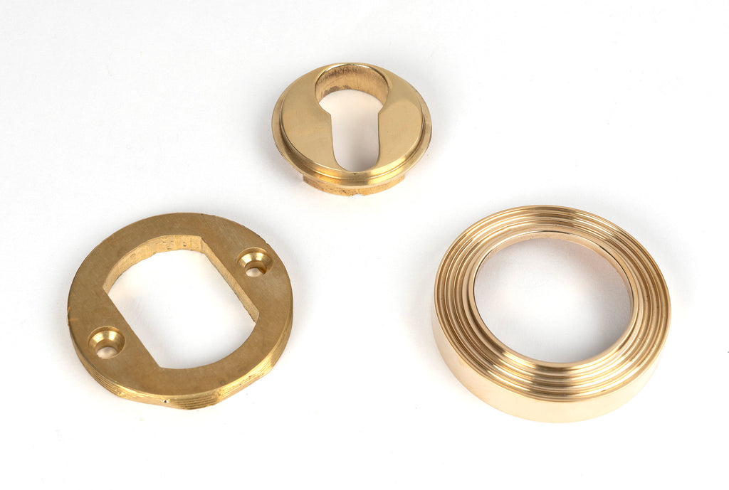 From The Anvil's Polished Brass Round Euro Escutcheon