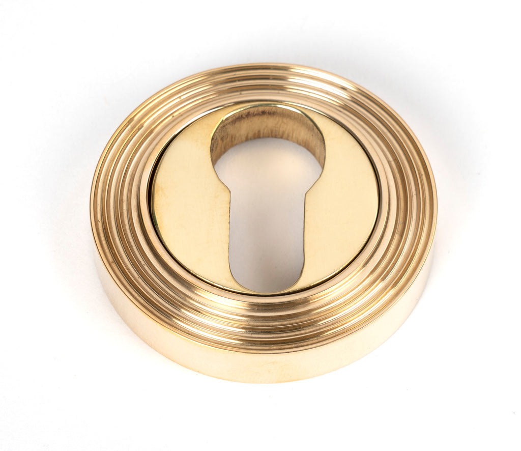 From The Anvil's Polished Brass Round Euro Escutcheon