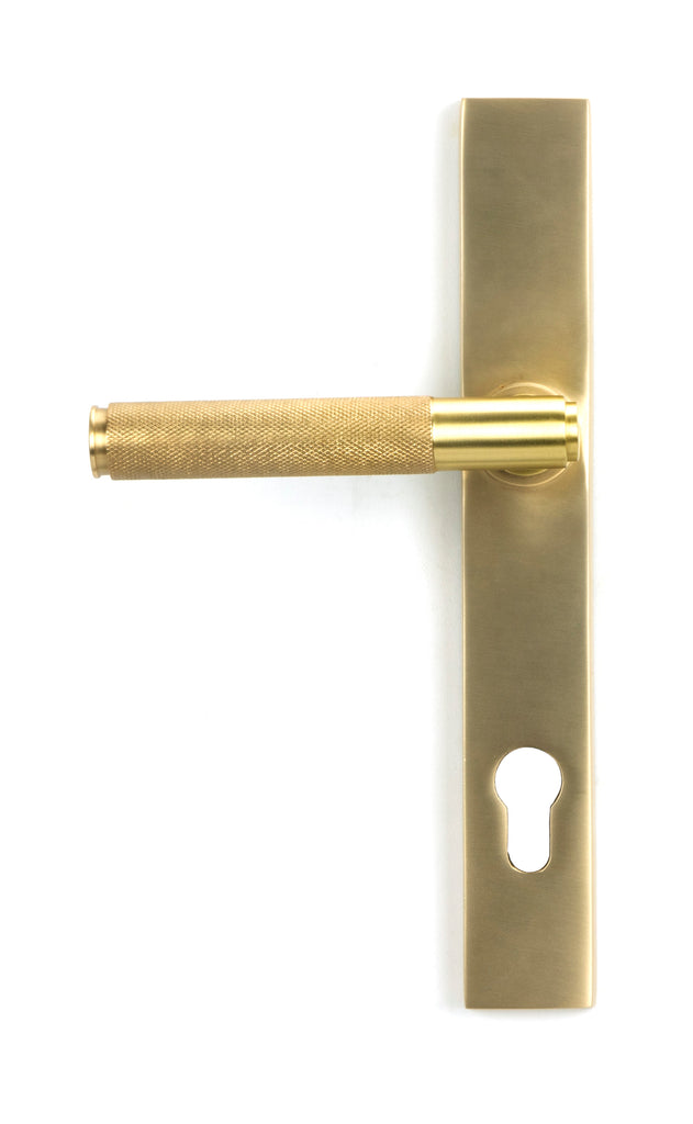 From The Anvil's Satin Brass Brompton Slimline Lever Espag. Lock Set