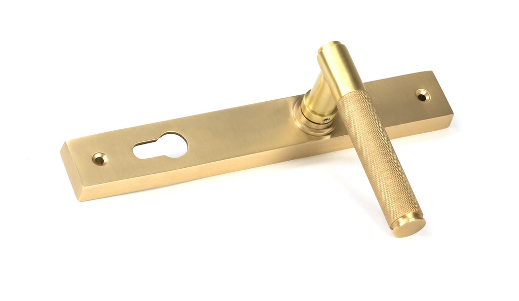 From The Anvil's Satin Brass Brompton Slimline Lever Espag. Lock Set