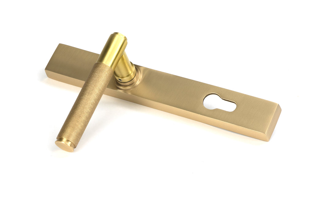 From The Anvil's Satin Brass Brompton Slimline Lever Espag. Lock Set