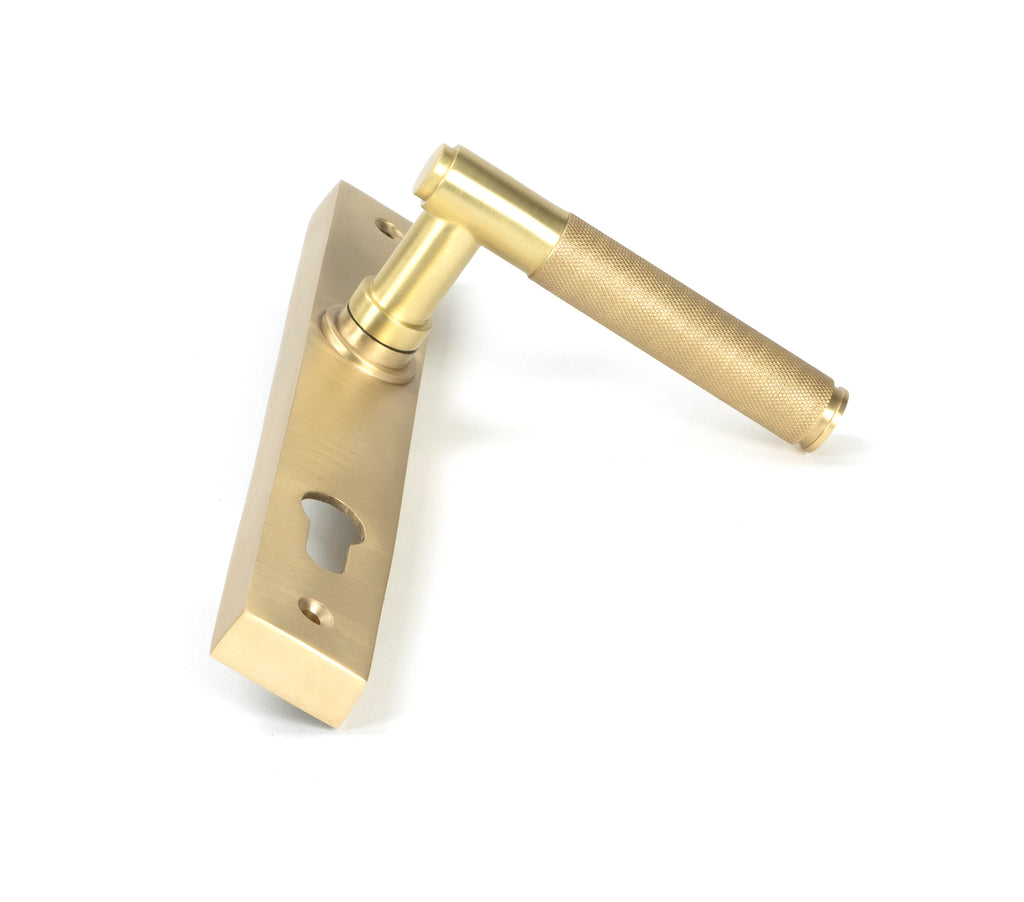 From The Anvil's Satin Brass Brompton Slimline Lever Espag. Lock Set