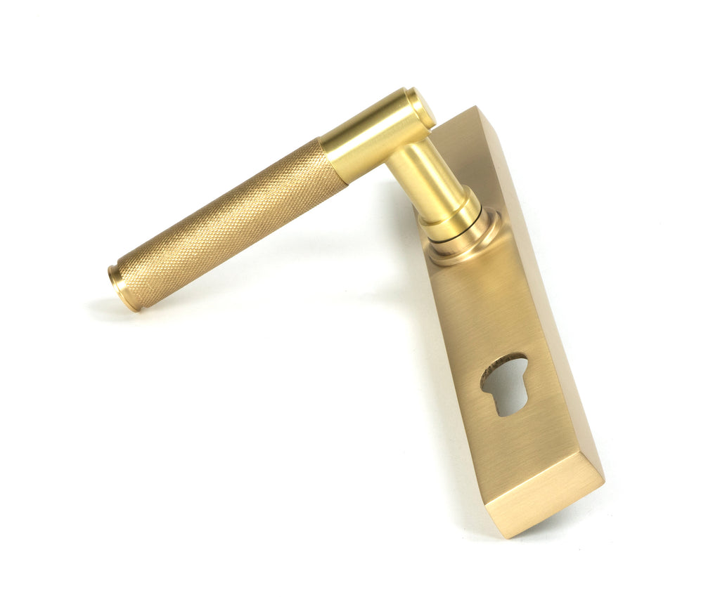 From The Anvil's Satin Brass Brompton Slimline Lever Espag. Lock Set