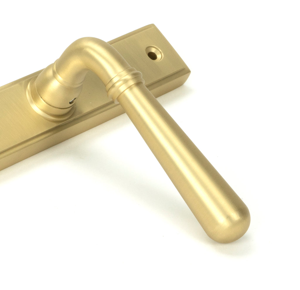 From The Anvil's Satin Brass Newbury Slimline Lever Espag. Lock Set