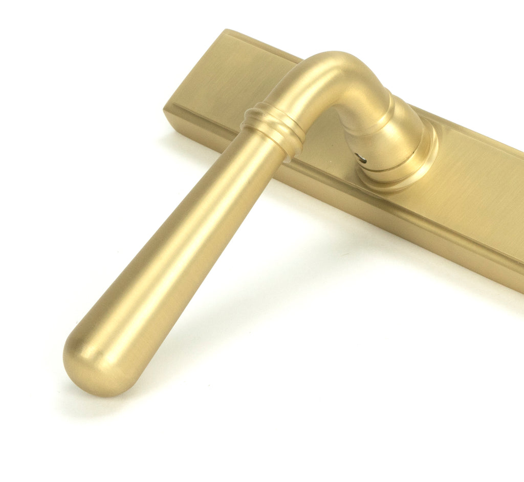 From The Anvil's Satin Brass Newbury Slimline Lever Espag. Lock Set