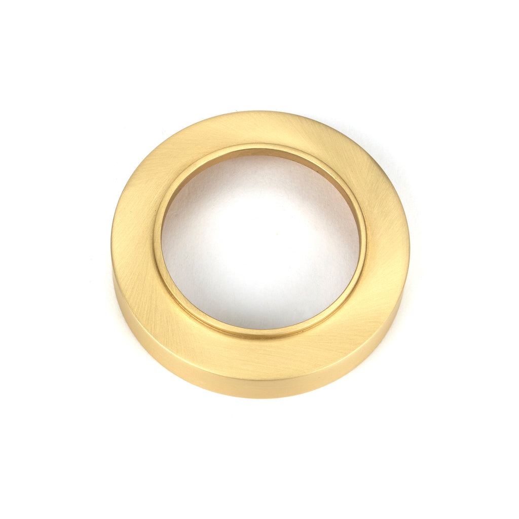 From The Anvil's Satin Brass Round Euro Escutcheon