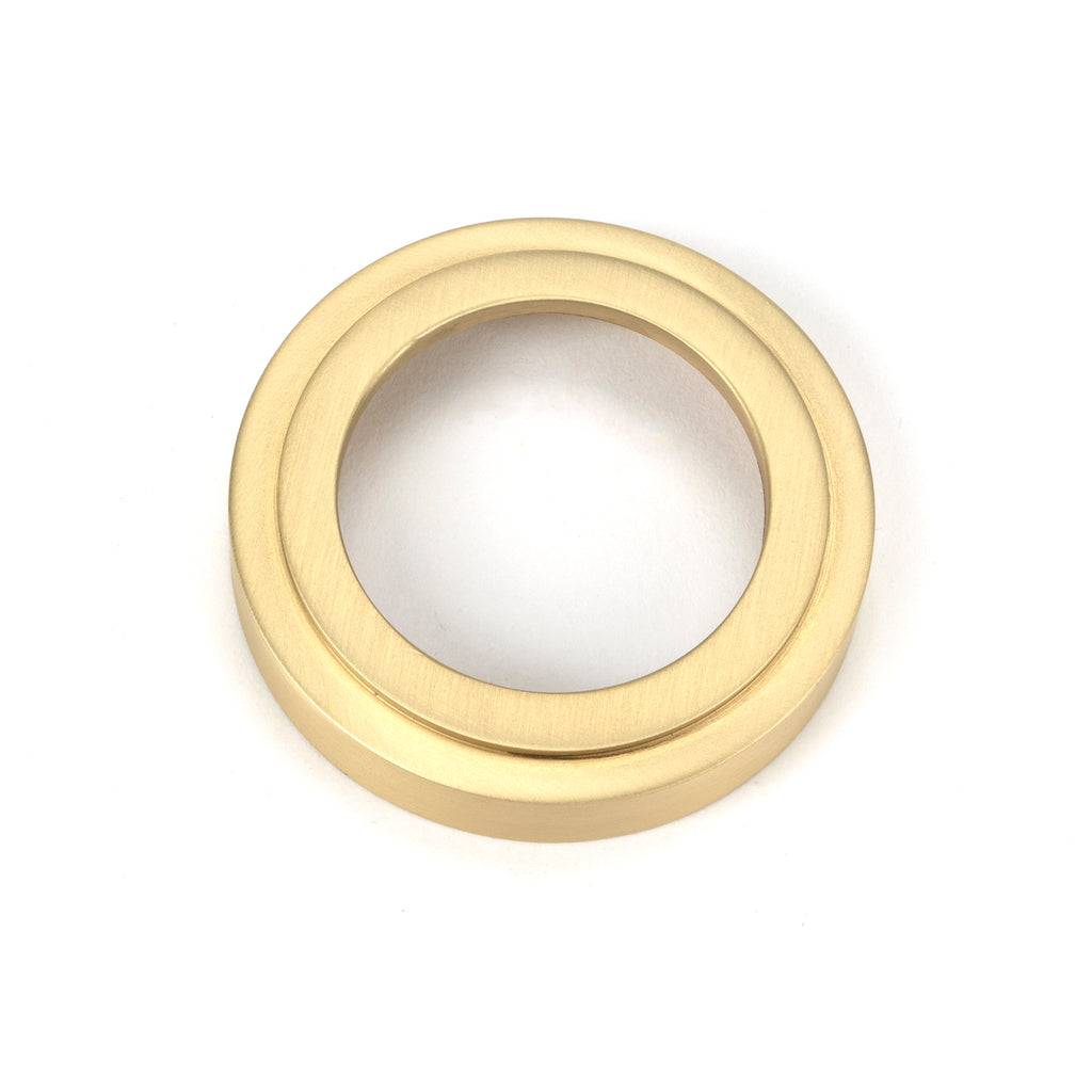 From The Anvil's Satin Brass Round Euro Escutcheon