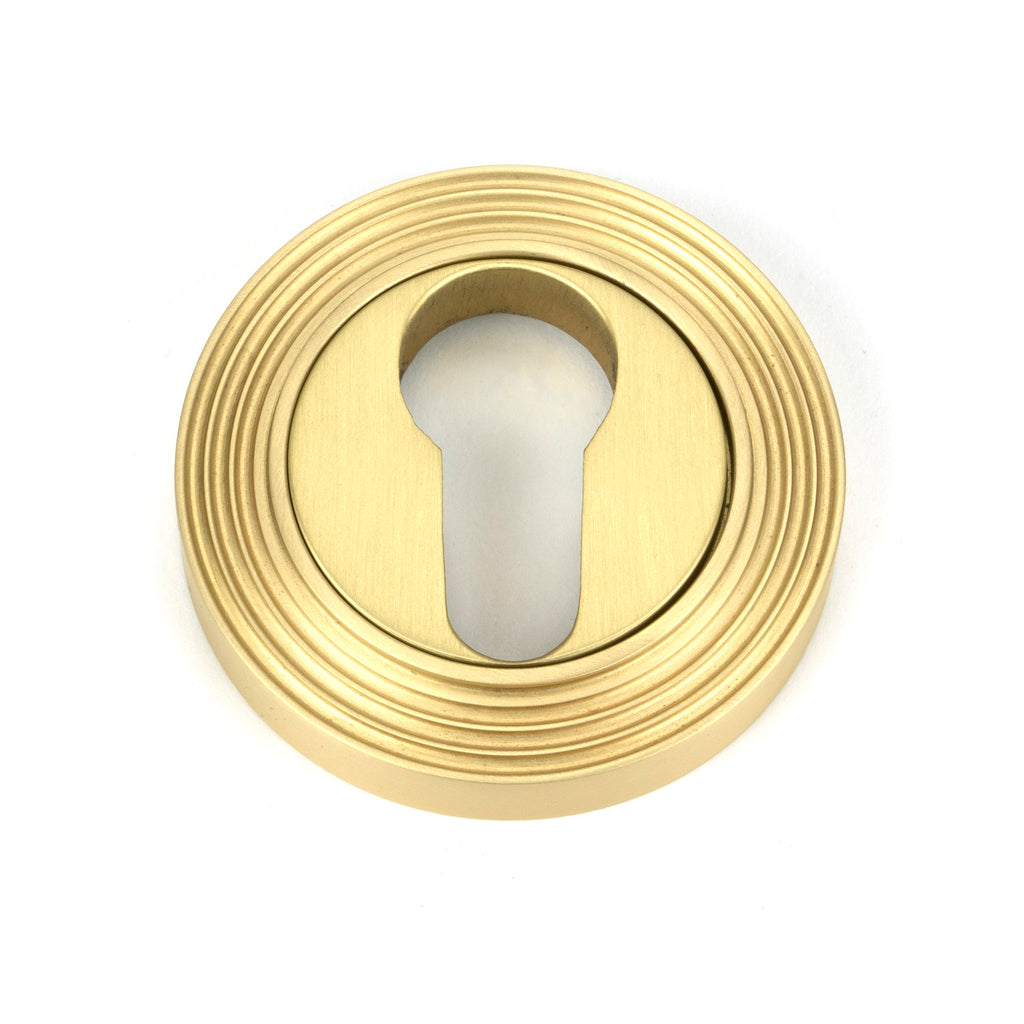 From The Anvil's Satin Brass Round Euro Escutcheon