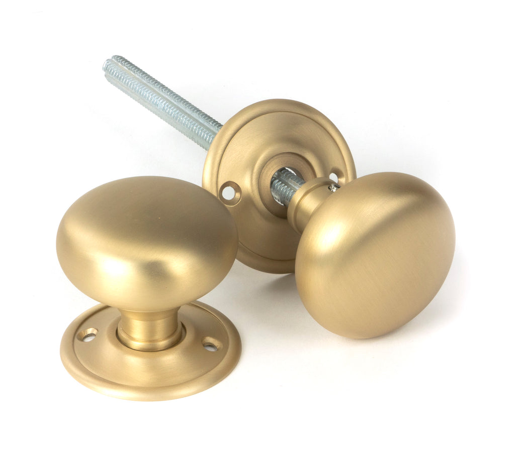 From The Anvil's Satin Brass Mushroom Mortice/Rim Knob Set