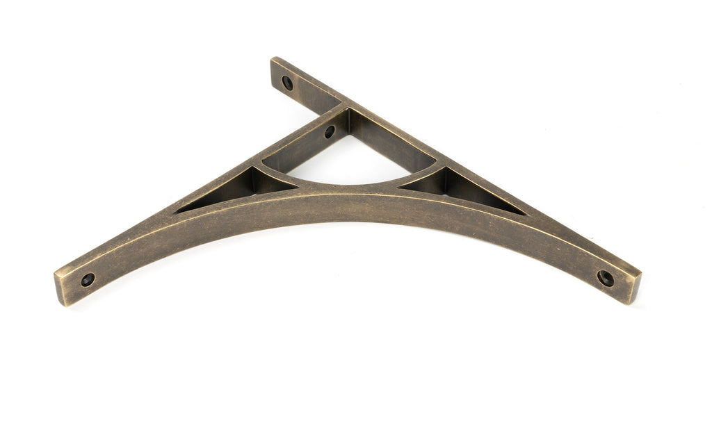 From The Anvil's Burnished Brass Tyne Shelf Bracket