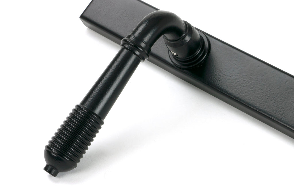 From The Anvil's Matt Black Reeded Slimline Lever Espag. Lock Set