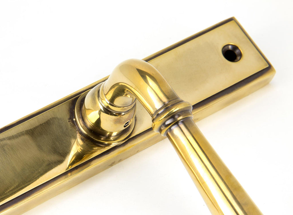 From The Anvil's Aged Brass Newbury Slimline Lever Espag. Lock Set