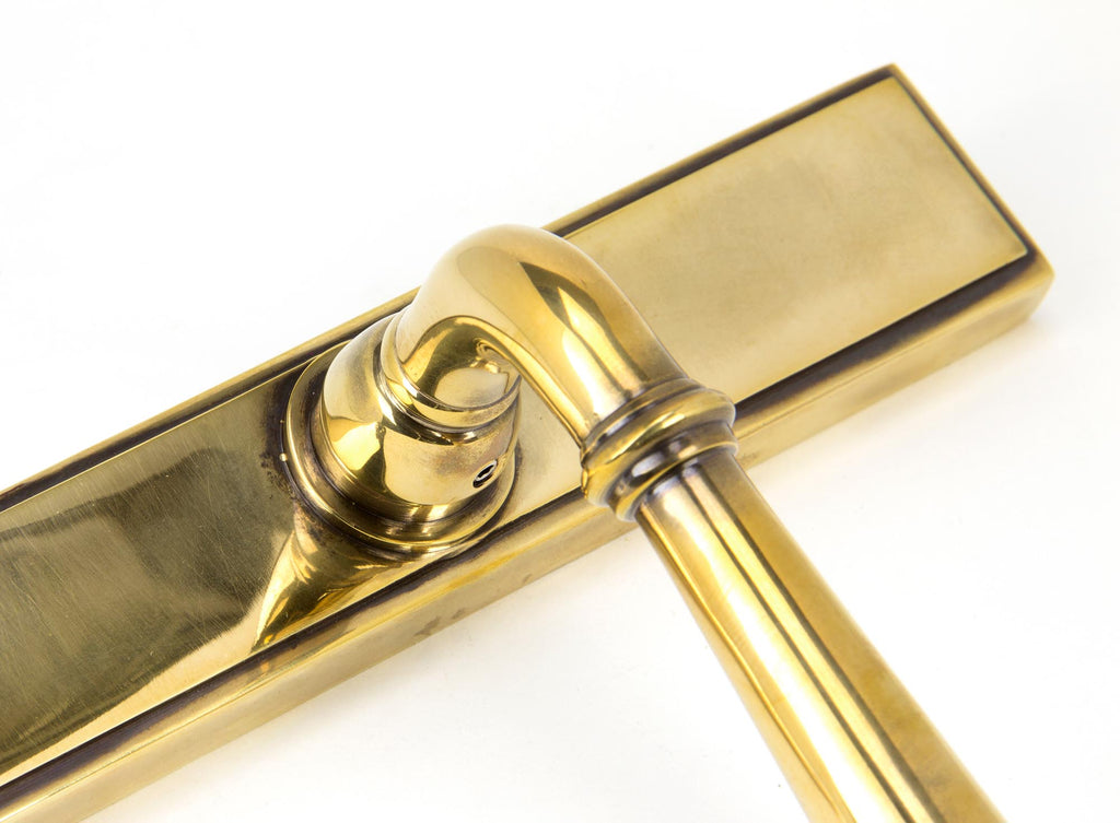 From The Anvil's Aged Brass Newbury Slimline Lever Espag. Lock Set